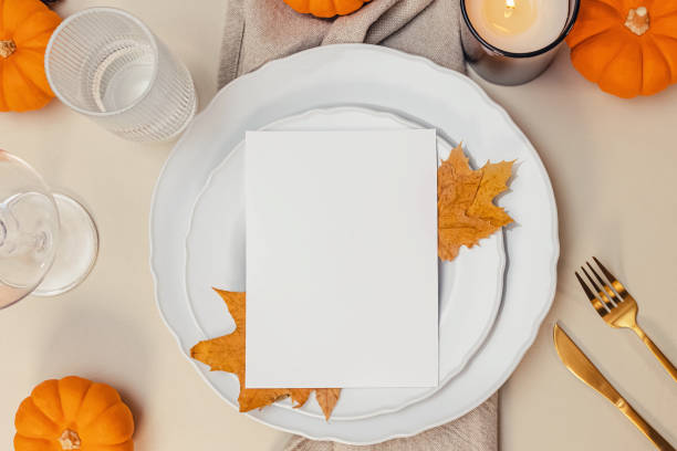istock Thanksgiving invitation, card mock-up, fall table setting with leaves and blank paper, 2133462835