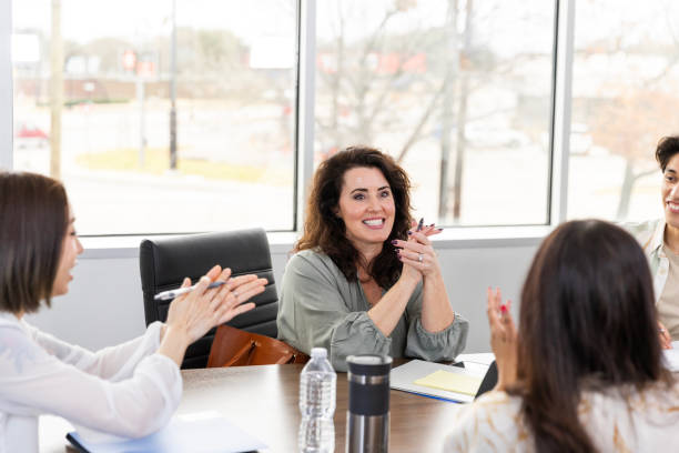 istock Diverse colleagues applaud businesswoman's success 2133473384