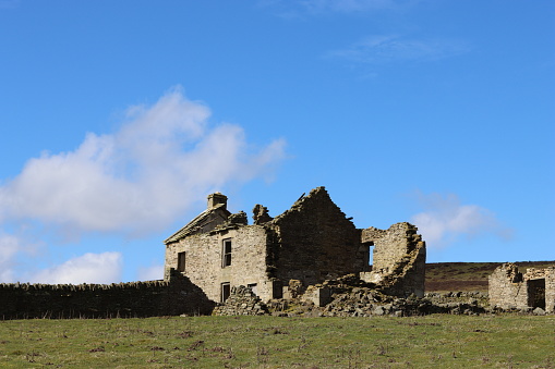 Abandoned farmhouse in remote countryside