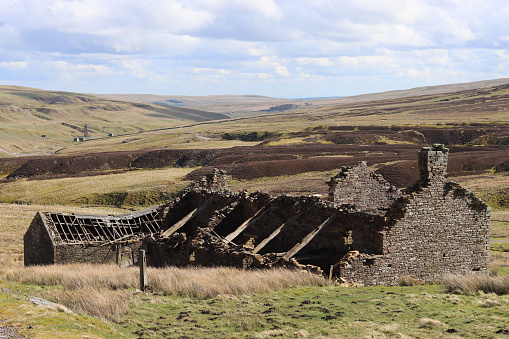 Ruins of an abandoned farmhouse in remote countryside