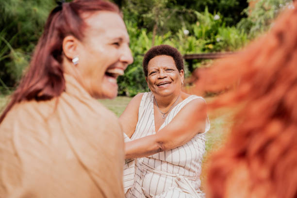 istock Female friends talking on a house yards 2133552824