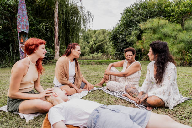 istock Female friends talking on a house yards 2133552828