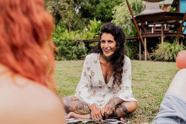 istock Female friends talking on a house yards 2133552832
