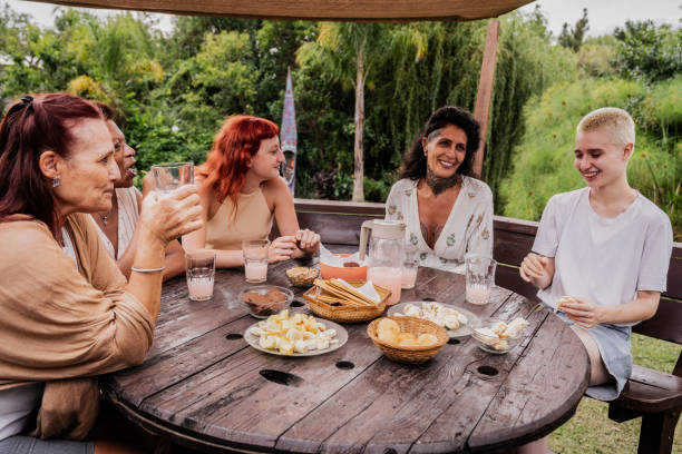 istock Female friends talking during a outdoor breakfast 2133554413
