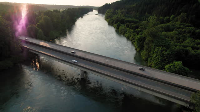 Transportation Aerial with Cars Driving Over Rural River Bridge