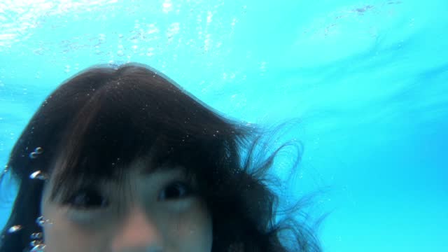 Young girl enjoying underwater fun