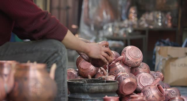 Copper Crafting Handicraft, Tinning copper, Crafting copper goods by artisans in the bazaar