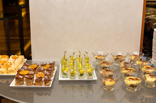Different kinds of dessert at a banquet dedicated to a wedding, birthday or other festive date.