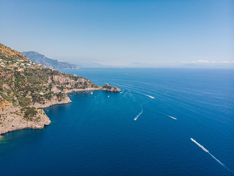 blue blue color of water and mountains. the road along the Amalfi coast and Positano. boats sail across the sea