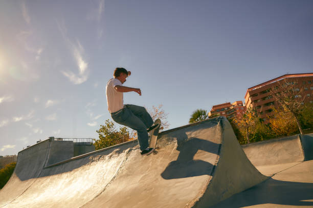 istock Active young man doing tricks on his skateboard at the skate park. Active sport concept 2133634996