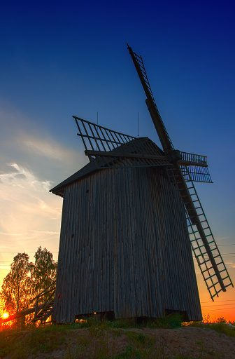 Wooden old, historic windmill, sight of sunset, picturesque sky