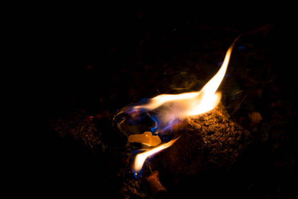 Burning candles on a dark street