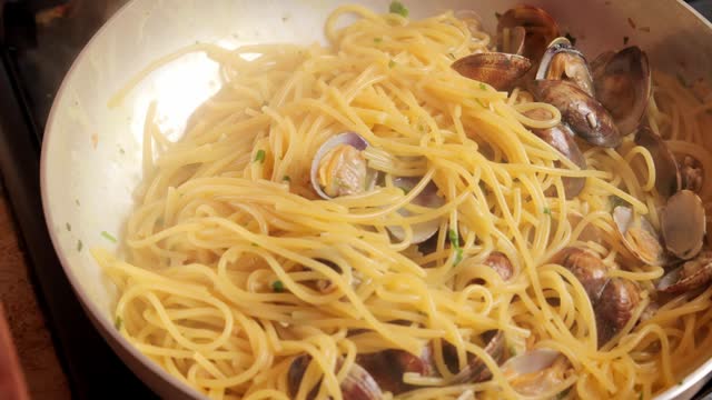 Cooking Spaghetti with clams, Italian food