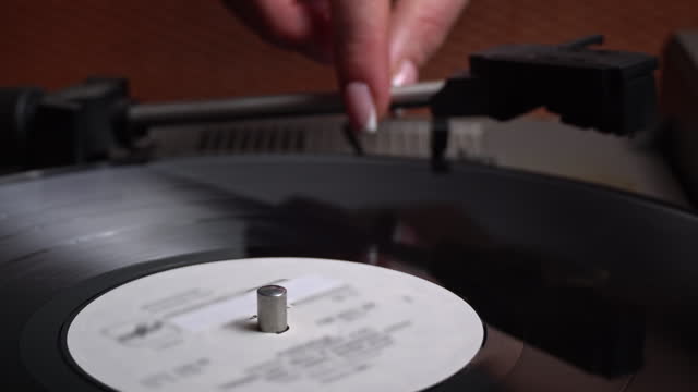 Old Retro Player Spins a Vinyl Record, Close-up