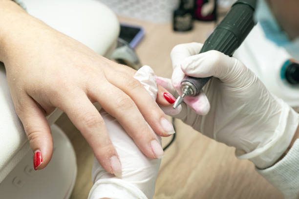 istock Manicure process, cleaning nails with a milling cutter close up 2133710762