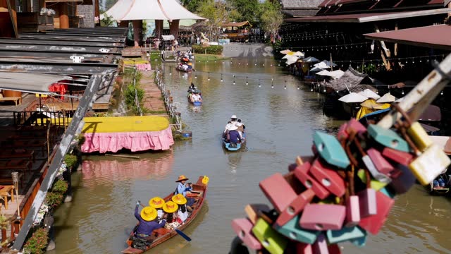Pattaya Floating Market. Small Tourist Wooden Boat moving along the Water. Thailand