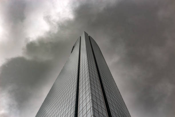 Clouds reflect off a glass skyscraper in Downtown Tampa, FL