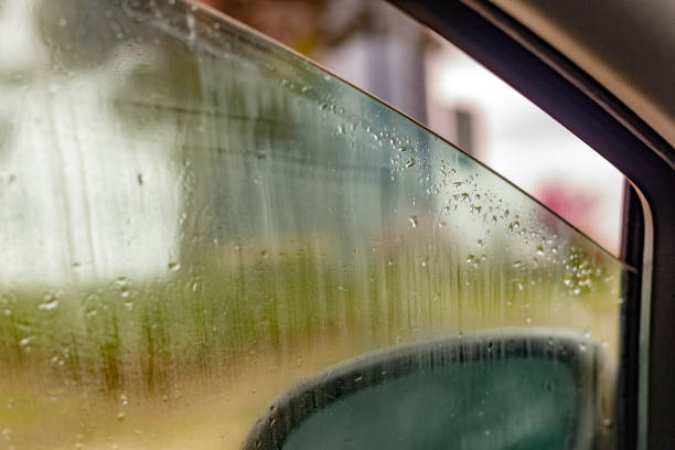 Madrid, Spain. Vehicle window partially rolled down to prevent condensation due to low temperatures and humidity.