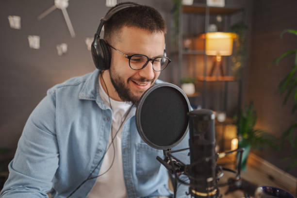 istock Caucasian men with headphones recording a podcast 2133765607