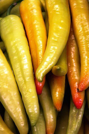 spicy yellow chili peppers, close up on the market, güeros chiles