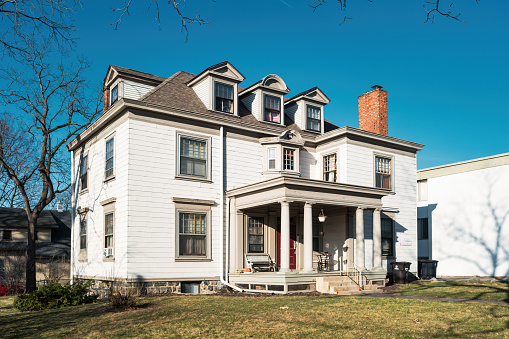 Large, traditional house in Ann Arbor, Michigan, USA on a sunny day.