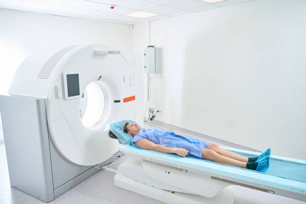 istock Patient prepared for computed tomography procedure in clinic 2133871042