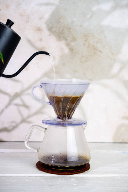 istock brewing coffee on white wooden background 2133905242
