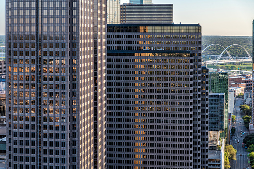 Close up view of the center and top portions of two skyscrapers in downtown Dallas Texas shot via helicopter from an altitude of about 300 feet.