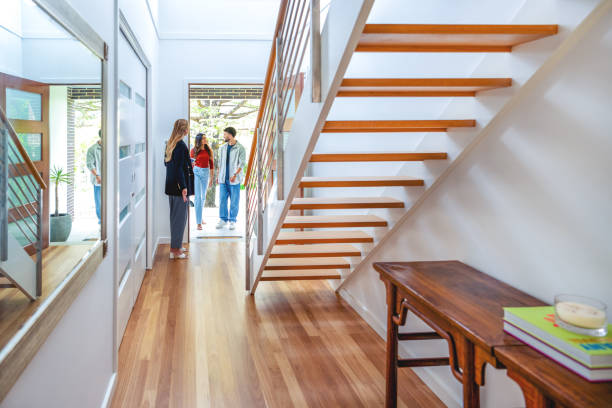 istock Real estate agent showing a young couple a new house. 2133938708