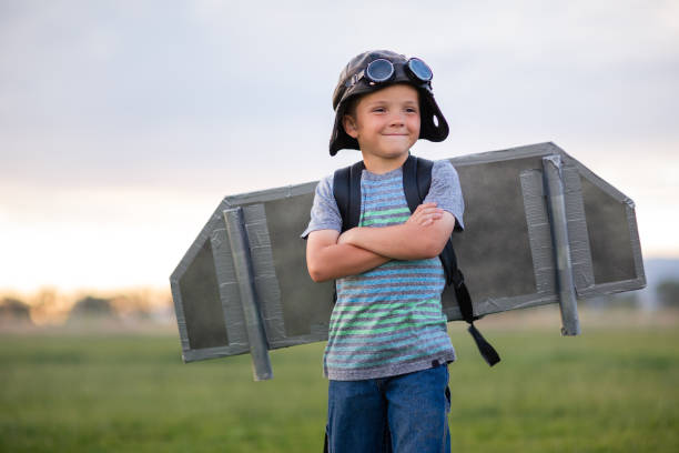 istock Young Boy with Jetpack in Grassy Field 2133950023
