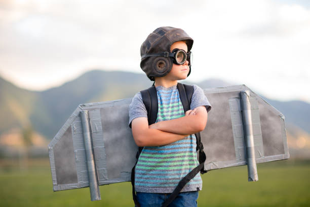 istock Young Boy with Jetpack in Grassy Field 2133951050
