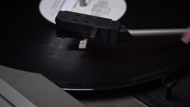 Old Retro Player Spins a Vinyl Record, Close-up