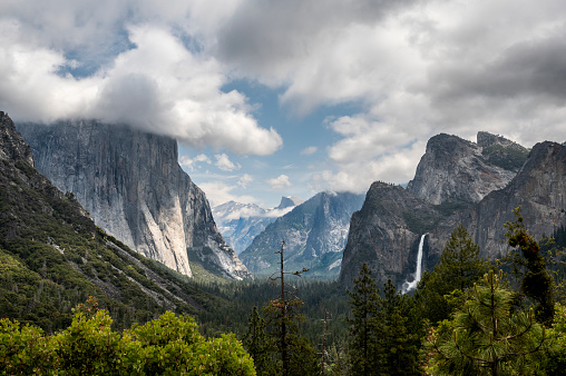 Yosemite national park, California, beautiful Tunnel View with waterfall. El Capitan with cloud on top.