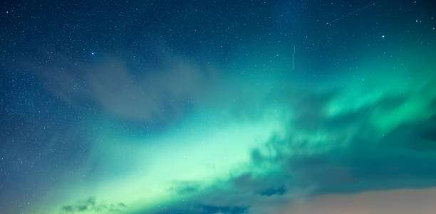 istock Aurora borealis, Northern lights glowing with starry in the night sky 2134108685