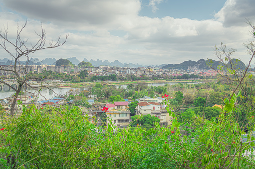 Summer landscape of Guilin town city with karst mountains in the background, Guangxi Province, China