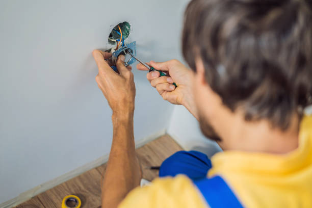istock Master electrician installs a socket in the house 2134171662