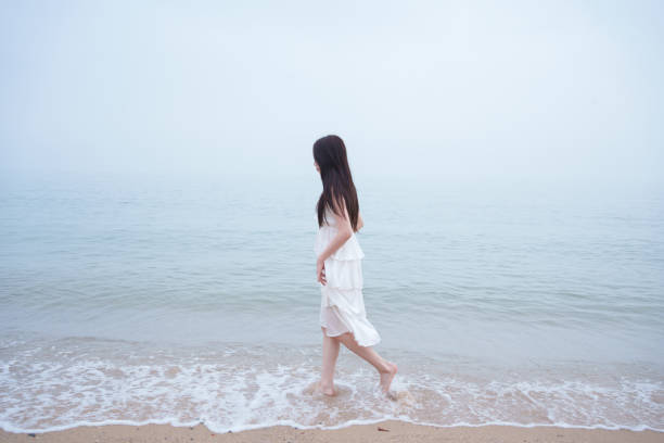 Female tourist walking on the beach