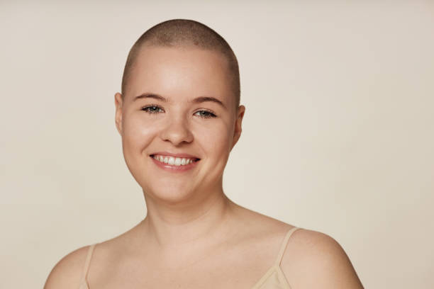 istock Happy Young Woman With Shaved Head 2134268259