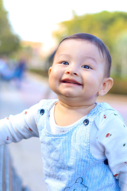istock Smiling baby face in a park 2134275141
