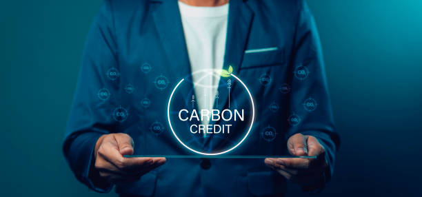 istock Businessman uses technology to exchange carbon credits Zero net greenhouse gas emissions target Carbon footprint reduction, CO2 emissions, low emissions 2134279613
