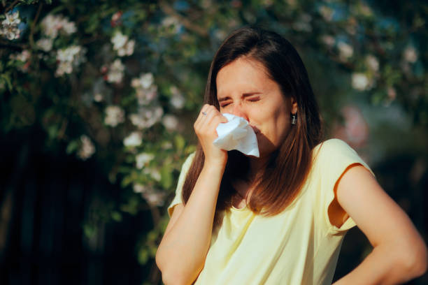 istock Woman Sneezing During Spring Blooming Season from Allergies 2134302307