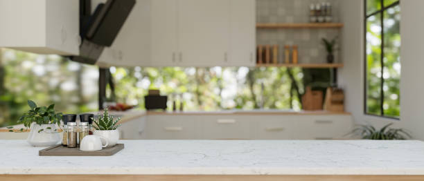 istock A white kitchen tabletop or kitchen island in a modern white and clean kitchen. 2134394310