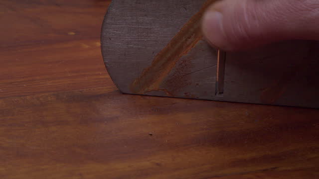 Close up view: Rusty antique wood plane reassembled after sharpening