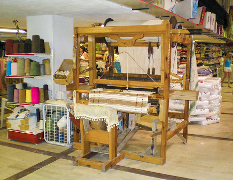 Antalya, Turkey, August 10, 2007 : An antique well-preserved wooden loom on display in a hardware store in Antalya city in Turkey.