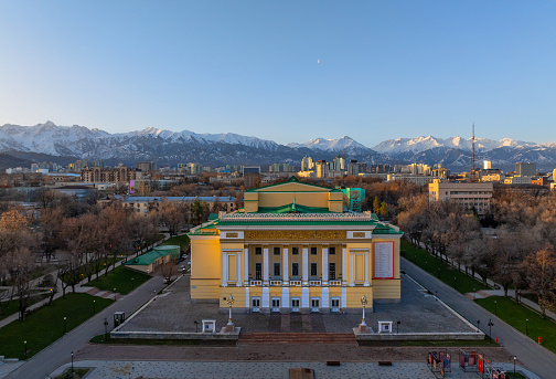 Almaty, Kazakhstan, 02.04.2024. Morning spring view from the quadcopret of the central part of the Kazakh city of Almaty and the building of the National Opera and Ballet Theater built in 1941