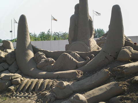 Antalya, Turkey, August 08, 2007 : Sand traveler sleeping on big bones at the sand figure festival based on the Arabian tales the 1001 Nights of Antalya City 2007 in Antalya in Turkey