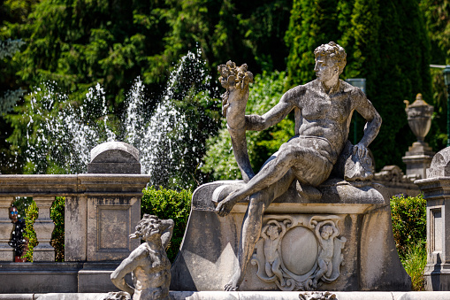 Sinaia, Brașov, România - July 29, 2022: Statue in the Garden of the Peles Castle Romania