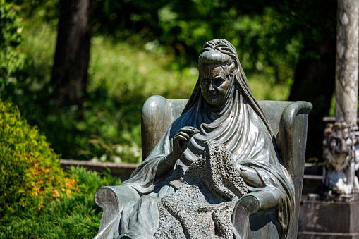Sinaia, Brașov, România - July 29, 2022: Statue in the Garden of the Peles Castle Romania