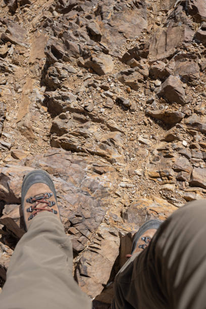istock Hiker legs on rocky mountains 2134577223