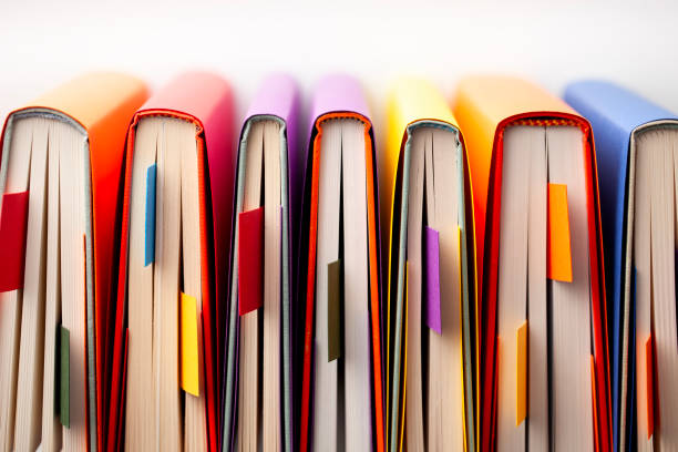 Floating data particles descend into an open book, symbolizing technology-driven education, artificial intelligence, and information exchange.